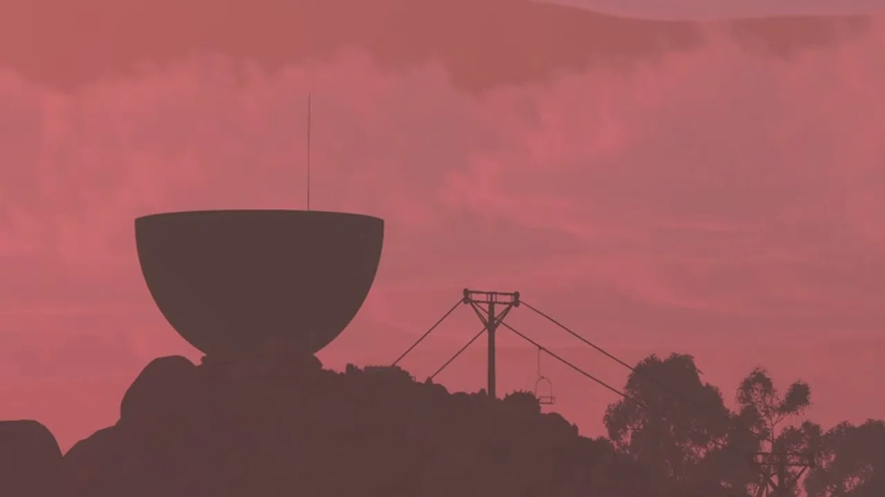 A dark tower silhouette against a red sky